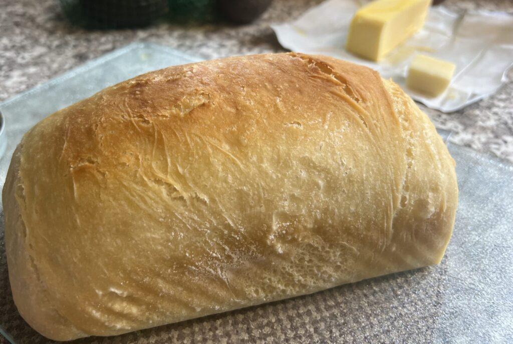 A freshly baked homemade artisan loaf bread.